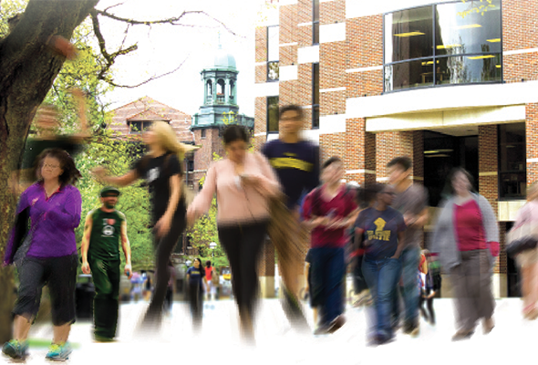 image of campus with many different students walking 